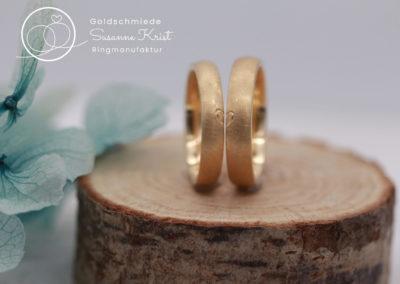 Ringe mit Herzhälften aus Gold